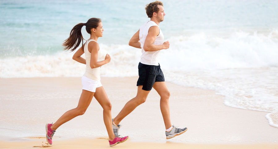Couple running on beach